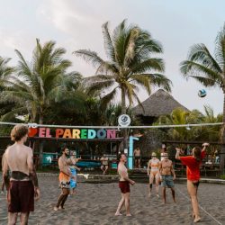 a volleyball match being played on the beach at El paredon